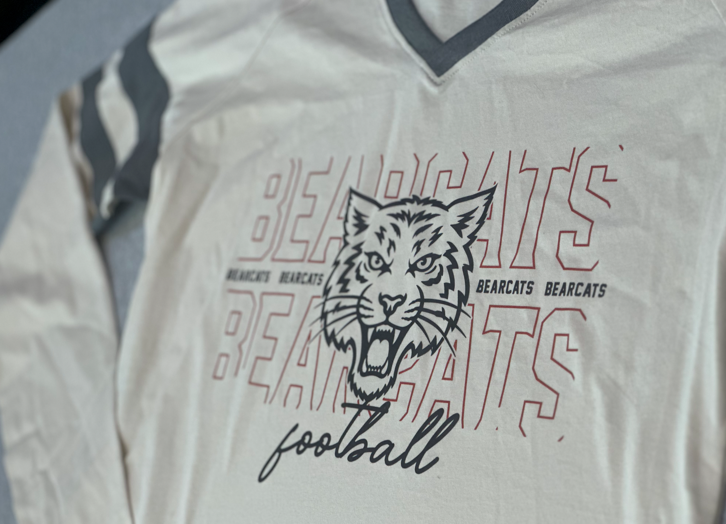 Aledo FootballBearcat Face Logo V-Neck Long Sleeve Stripe Tee